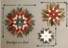 three wooden snowflakes are hanging on the wall next to each other with measurements