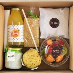 a box filled with food and drinks on top of a table