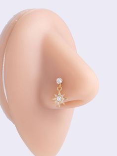 a close up view of a fake nose with an earring on it's side