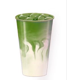 a green and white cup with liquid in it