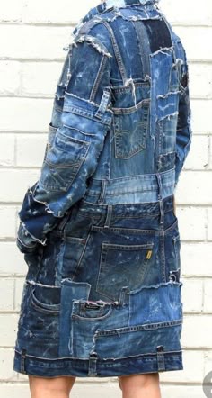 the back of a woman's jean jacket that has been altered to look like an old