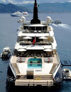 a large white boat floating on top of a body of water