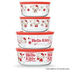 three glass bowls with hello kitty designs on the lids are stacked up in front of each other