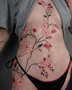 a woman's stomach with flowers on it