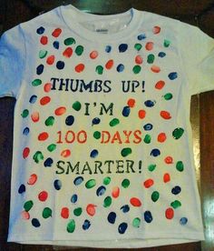 a t - shirt that says thumbs up i'm 100 days smarter