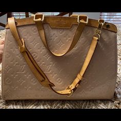 Omg!!! This Bag Is Amazing!!! It Is Glossy, Monogram, Embossed Vernis Taupe Patent Leather. There Is A Slight Light Blue Mark On Front, Bottom (Shown In Picture). It Honestly Isn’t Noticeable. Louis Vuitton Pallas Clutch, Louis Vuitton Bucket Bag, Louis Vuitton Tivoli, Louis Vuitton Petit Noe, Louis Vuitton Pallas, Louis Vuitton Limited Edition, Kate Spade Sunglasses, Bags Louis Vuitton, Louis Vuitton Vernis