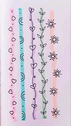 an open book with different colored lines and flowers on the pages, all lined up