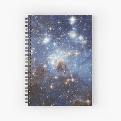 a spiral notebook with stars in the background