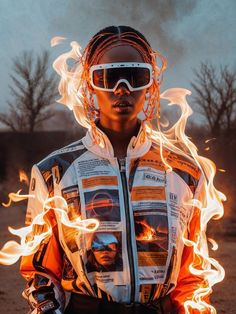 a woman in sunglasses and an orange jacket with flames around her