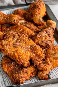 fried chicken wings are on a tray ready to be eaten