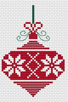 a cross stitch ornament hanging from a string on a cell phone with the text,