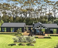 an artist's rendering of a house in the middle of a lush green field