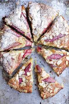 a cake that has been cut into eight pieces and is sitting on a plate with powdered sugar