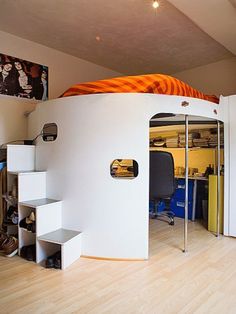 there is a loft bed in the middle of this room with stairs leading up to it