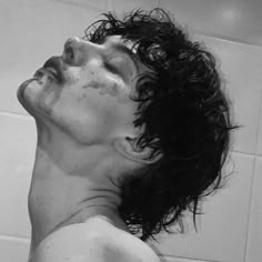 black and white photograph of a man in the shower