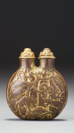 an ornate vase with two gold - plated handles