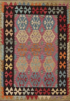 an old rug with different colors and designs