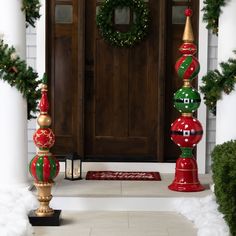 christmas decorations on the front porch of a house