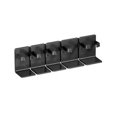 four black plastic holders are lined up against the wall