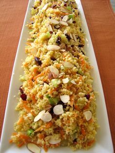 a white plate topped with food on top of a wooden table