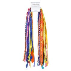 multicolored bracelets are hanging from a hook on a white hanger with a tag