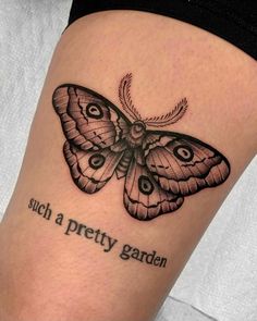 a black and white butterfly with words on it's side, which reads such a pretty garden