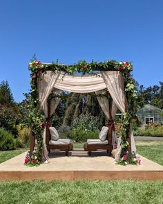 an outdoor wedding set up in the grass