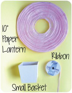 the instructions for how to make a paper lanterner and small basket with cd's