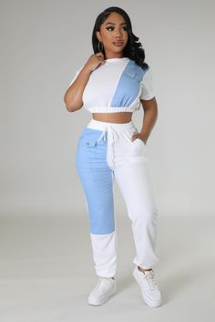 Two piece set Crop top Round neckline Short sleeves Denim detail Elastic waistband No closure High waisted pants Elastic waistband Pockets Denim detail Cuffed bottom No closure 100% cotton Wash warm Inseam is 32 inches Model is wearing a small MODEL STATS Height: 5.3"Bust:33" / Waist:28" / Hips:42" Please see size chart for information on the fit Casual Beach Wear, Special Event Dresses, Blue Angel, High Fashion Outfits, Denim Details, Pant Set, New Arrival Dress, Two Piece Set, Event Dresses