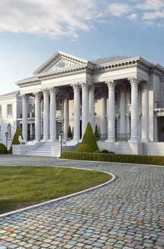 a large white building with columns and pillars