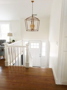 10 Best Split Foyer Entry Makeovers - My Creative Days Hi Ranch Entry Way, Farmhouse Raised Ranch, Raised Ranch Dining Room Ideas, Split Foyer Staircase Ideas, Ranch Stairs To Basement, Raised Ranch Stairs, Raised Ranch Kitchen Open Concept, Raised Ranch Railing Ideas, Split Home Remodel