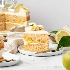 two slices of lemon cake on plates with one slice cut out and the other half eaten