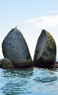 two large rocks sticking out of the water