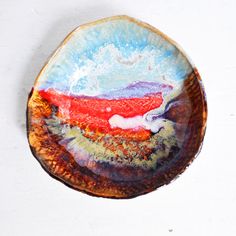 a plate with an abstract painting on it