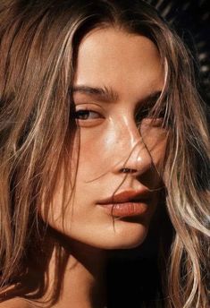 a close up of a woman with long hair