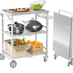 a kitchen cart with two pots and pans on it