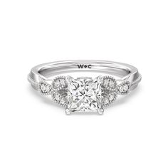 a white gold engagement ring with an oval cut diamond center and pave set shoulders