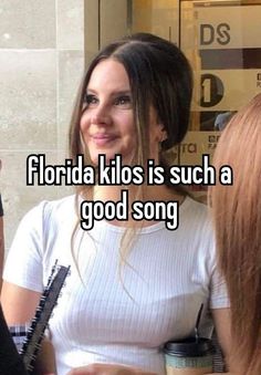 a woman holding a hair brush in her hand and talking to another person with the caption florida kilos is such a good song