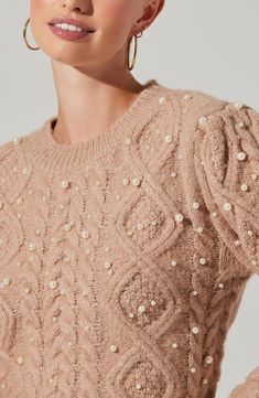 Pearly baubles adorn this wool-kissed sweater knit with chunky cable stitches for a cozy feel. 21 1/2" length (size Medium) Pearls: 5-9mm Crewneck Long sleeves 40% acrylic, 30% nylon, 25% polyester, 3% wool, 2% elastane Dry clean or machine wash, dry flat Imported Embellished Sweater, Stitch Sweater, Embellished Sweaters, Cable Stitch, Chic Party, Astr The Label, Knit Sweaters, Party Look, Party Looks