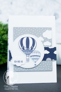 a close up of a card with a hot air balloon in the sky on it