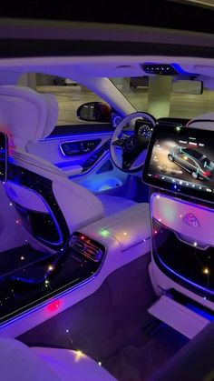 the interior of a car with blue lights