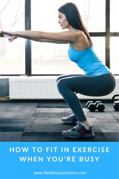 a woman doing squats in a gym