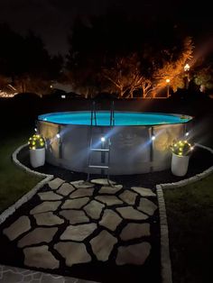 an above ground swimming pool at night