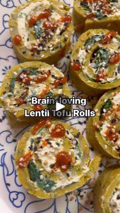 some food is sitting on a plate with blue and white designs around it that says brain loving lentil tofu rolls