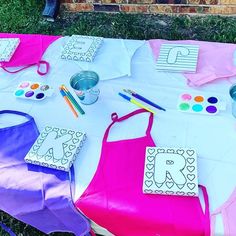 the table is covered with paper and crafting supplies for children's arts and crafts