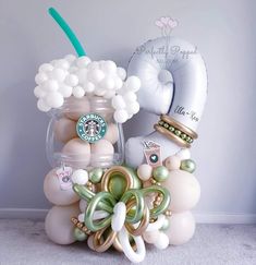 the balloon bouquet is filled with starbucks coffee balloons and other things to make it look like they are floating