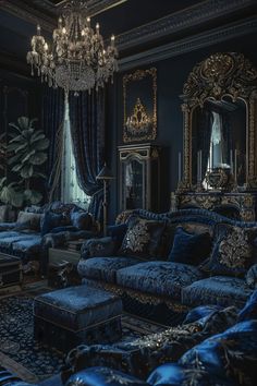 a living room filled with blue couches and a chandelier hanging from the ceiling