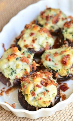 baked stuffed mushrooms with cheese and bacon in a white dish