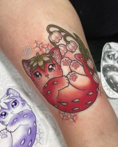 a close up of a person's arm with a tattoo on it and an animal