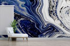 an abstract painting with blue and white colors on the wall next to a stair case